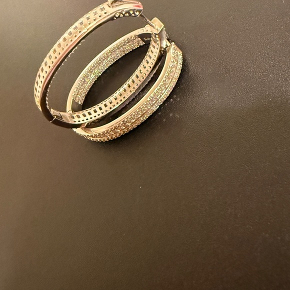 Elegant – These sparkling hoop earrings have a refined and sophisticated look. - Picture 7 of 14